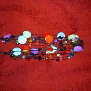 18+2" necklace. Multi colored "mother of pearl" on nylon cord. 7 layer necklace